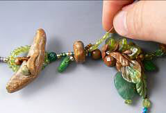 Clay toggle and glass beads on beading wire